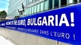 Poster "Bulgaria, welcome to the Euro" is seen in Brussels near the European comission