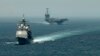 Американський ракетний крейсер USS Gettysburg (CG 64) та авіаносець USS Harry S. Truman (CVN 75) йдуть транзитом через Гібралтарську протоку до Середземного моря, 3 вересня 2013 року