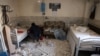 A man checks the debris at a room of Evin prison’s hospital after Israeli air strikes the previous month, in Tehran, on July 1, 2025.